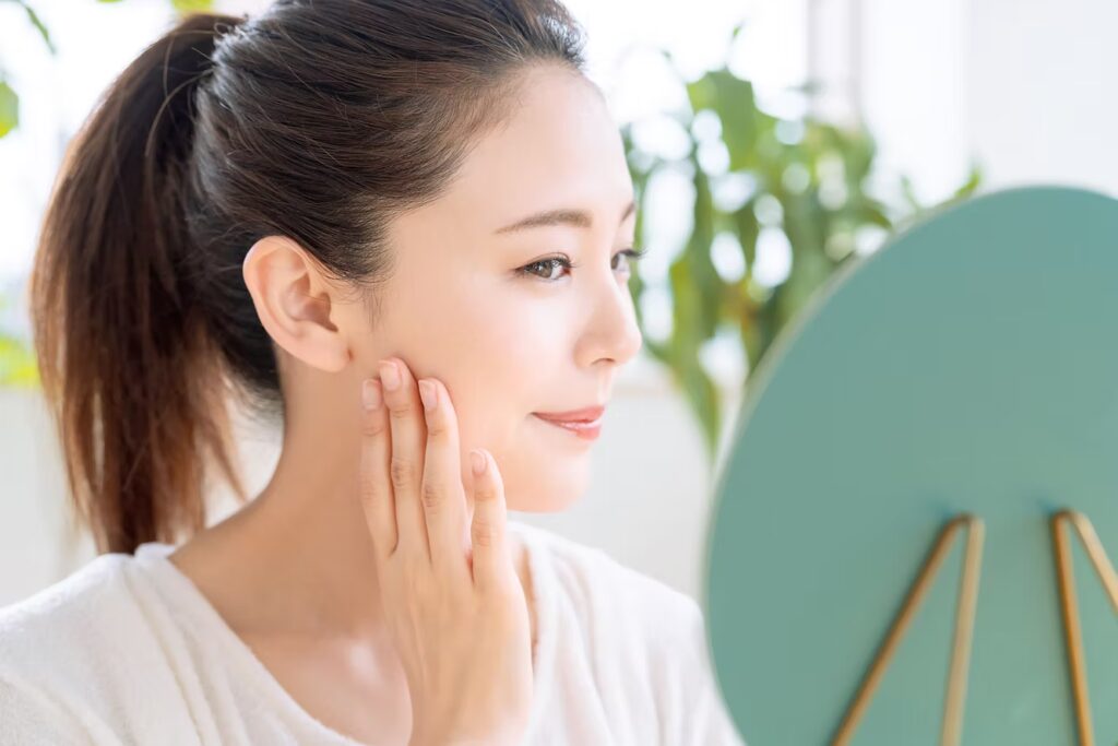 beautiful woman looking in the mirror