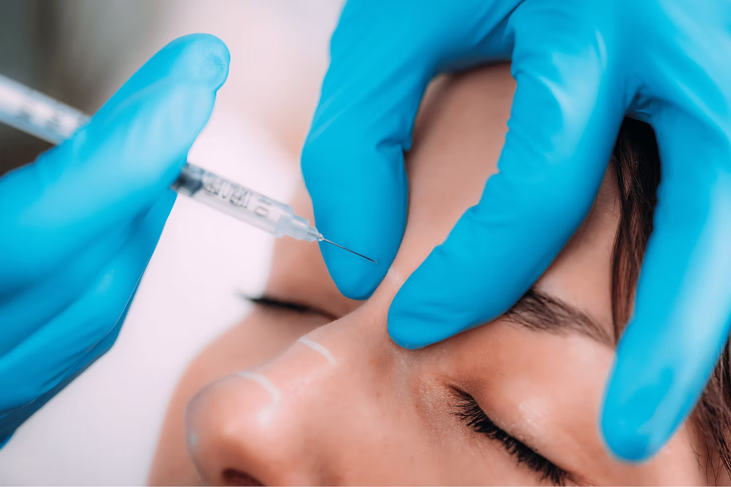 woman getting dermal fillers on nose